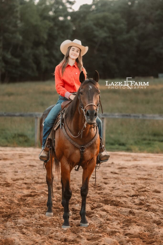 cowgirl riding her horse