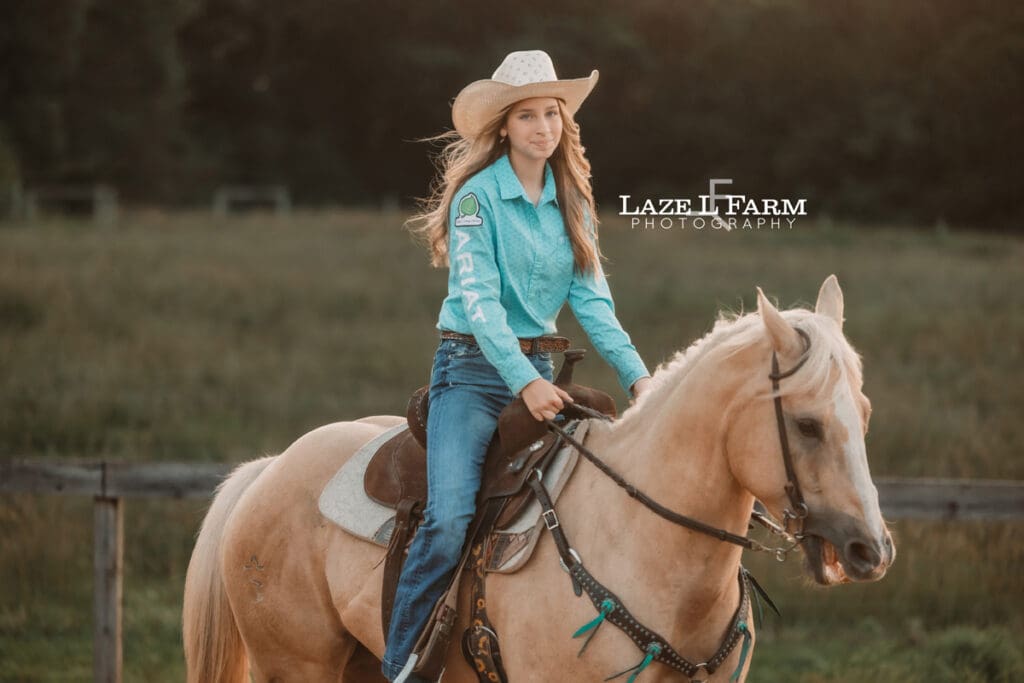cowgirl trotting her horse