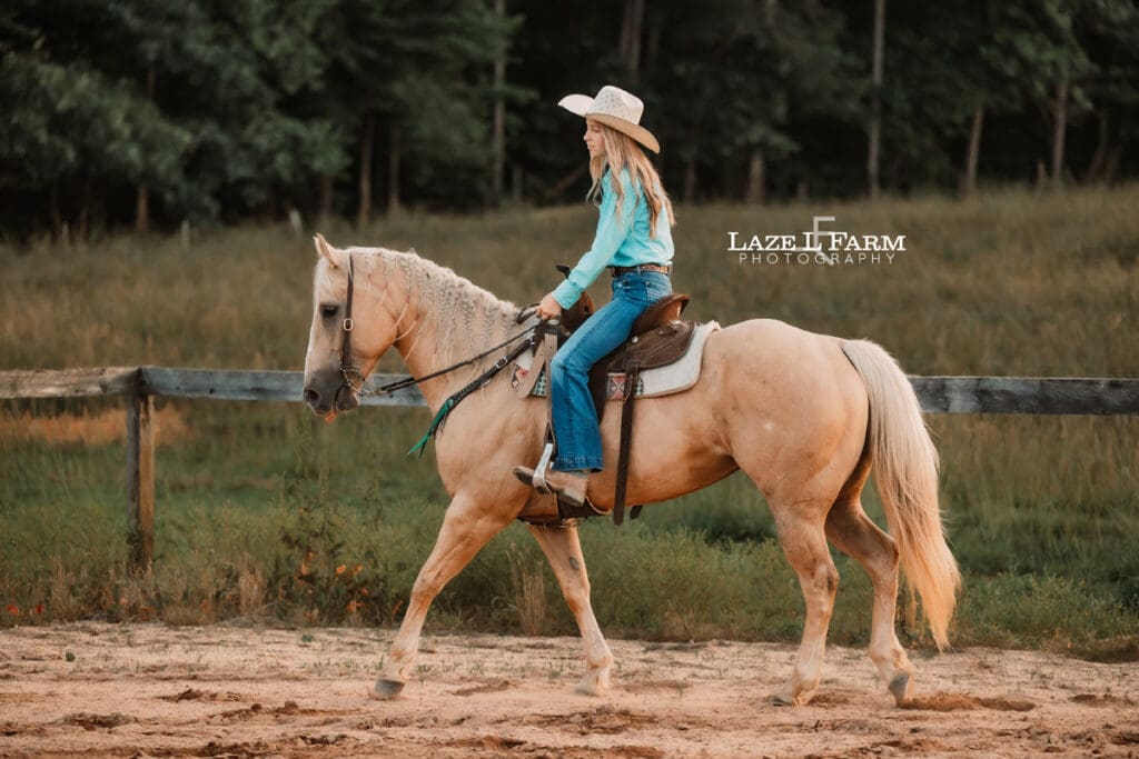 cowgirl riding her horse