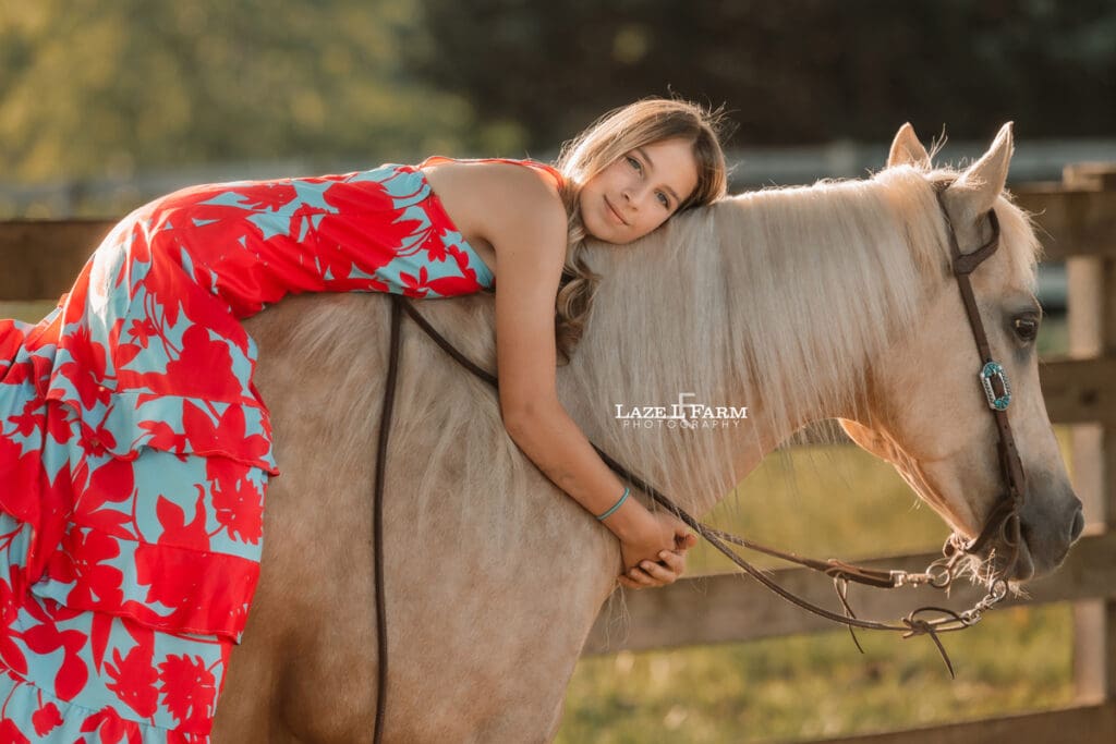 girl giving her horse a dress