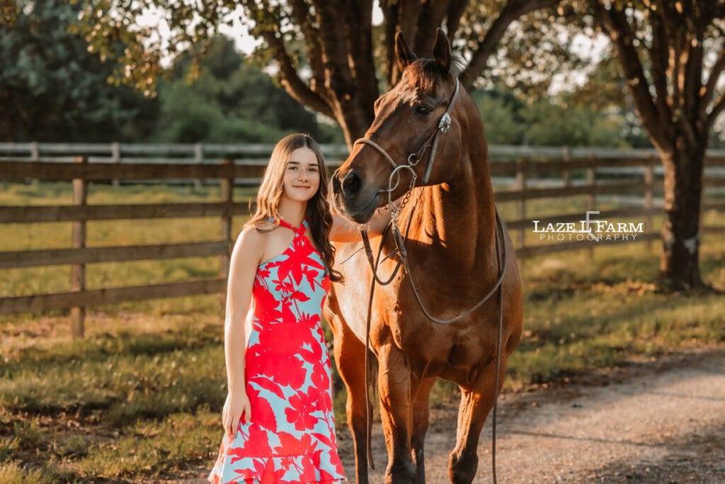 girl standing beside of her horse