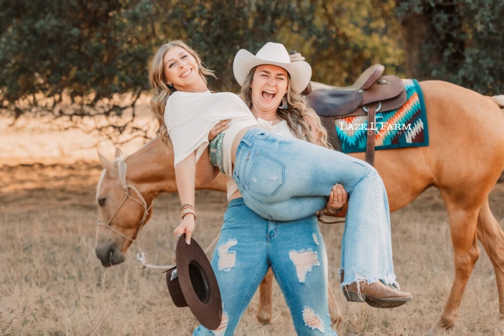 cowgirl best friends lifting each other up