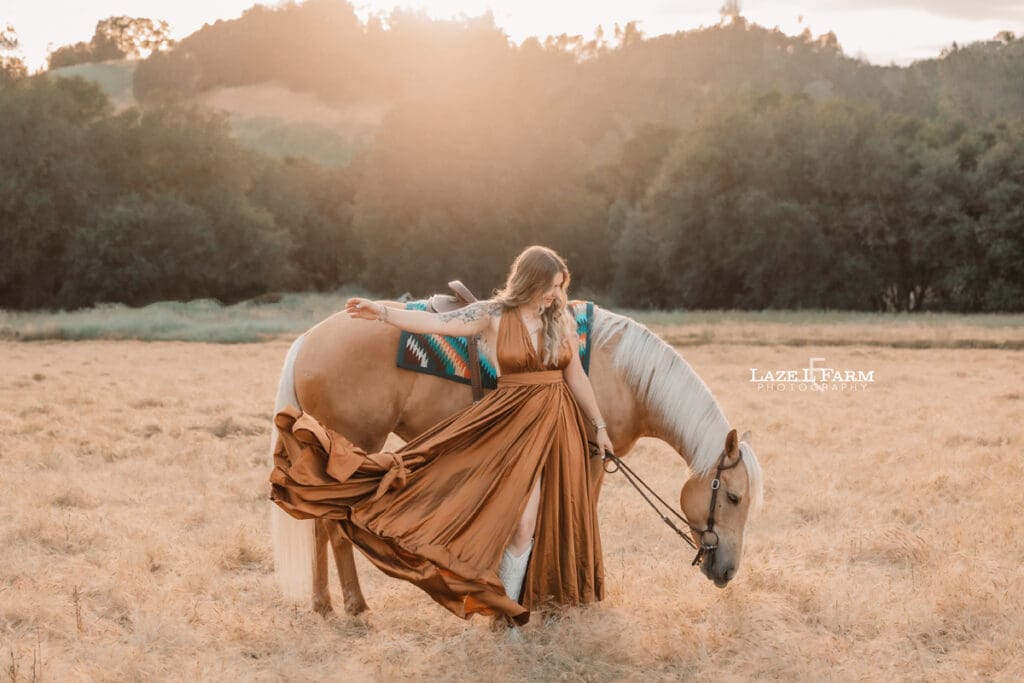 girl in a copper flowy dress at sunset