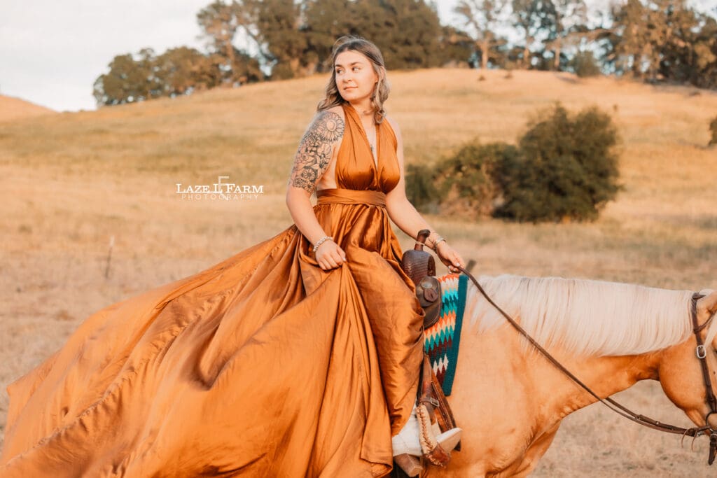 a girl with a parachute dress riding her horse