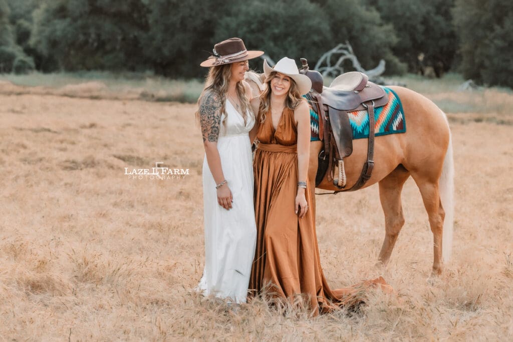 best friends in dresses in a field