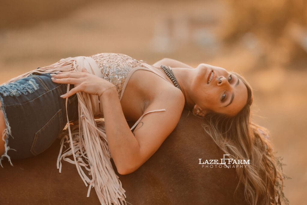 cowgirl on the back of a horse