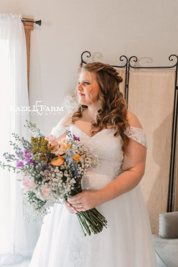 Bride getting ready on her wedding day at Woodside Farm in Graham, NC with pictures by Laze L Farm Photography