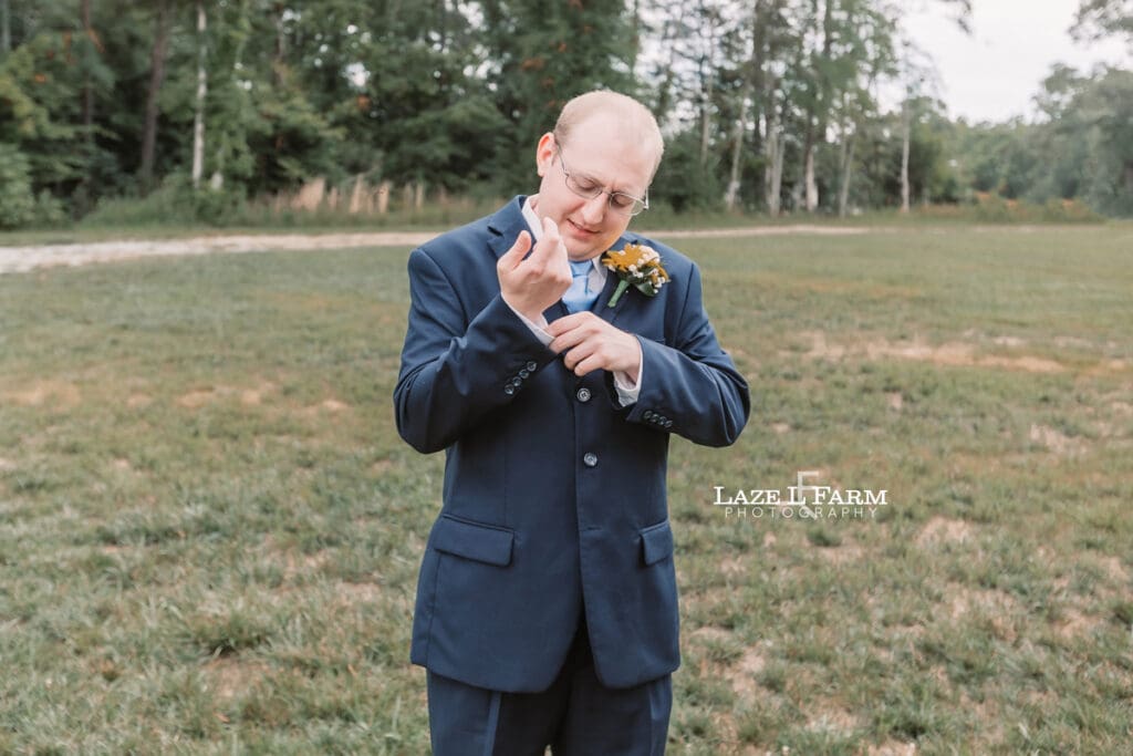 Groom on his wedding day at Woodside Farm in Graham, NC with pictures by Laze L Farm Photography