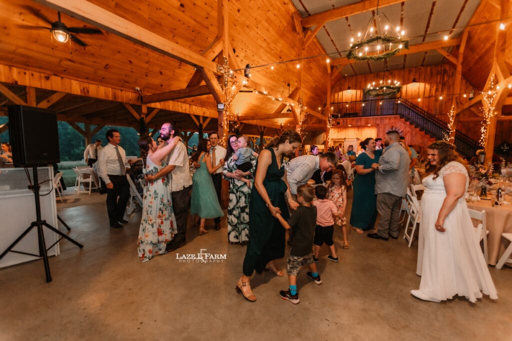 Dancing during the wedding at Woodside Farm in Graham, NC with pictures by Laze L Farm Photography
