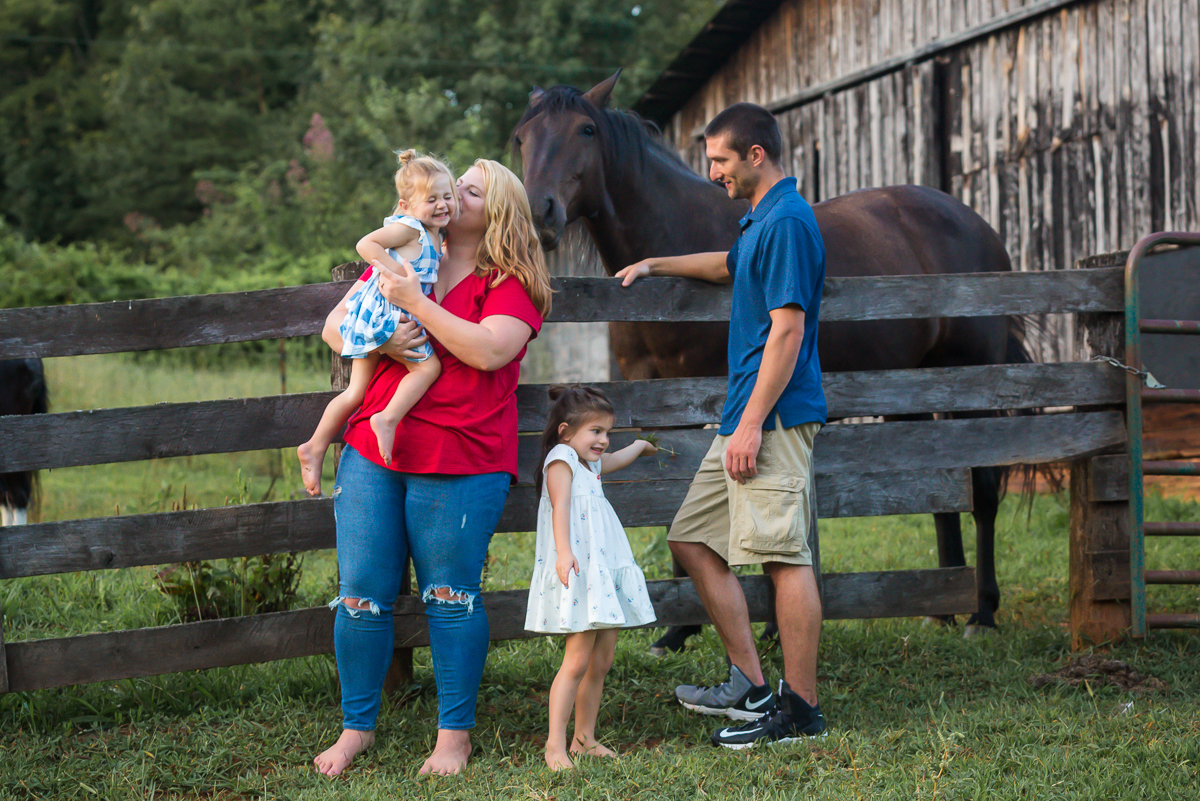 Laze L Farm Photography | Farm Session | Taylorsville NC | Family standing in front of wooden fence