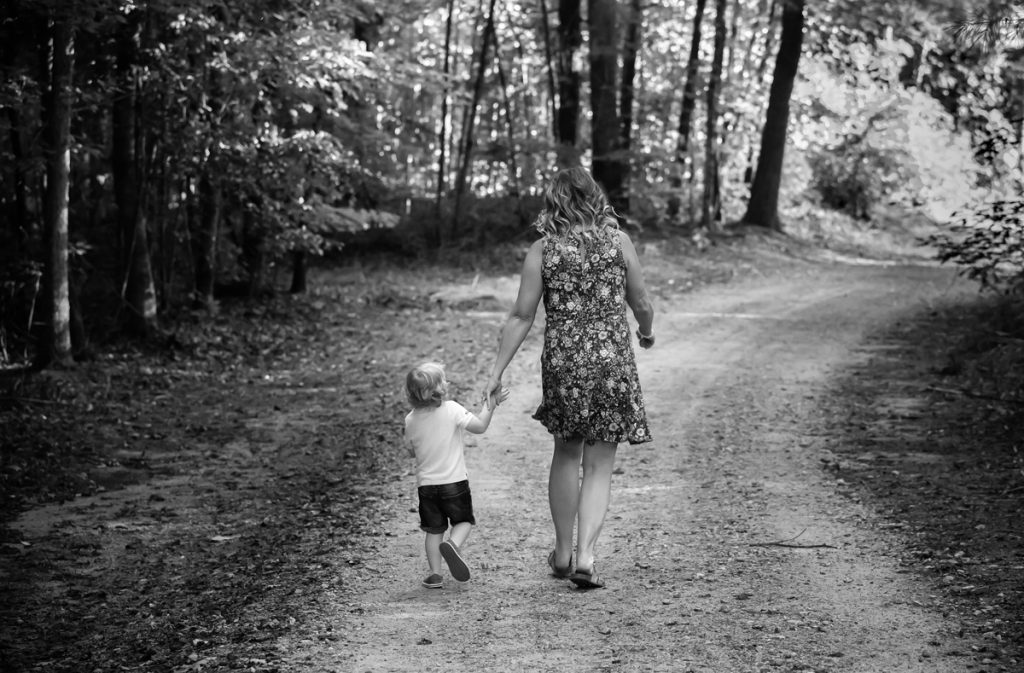 Laze L Farm Photography | Farm Session | Taylorsville North Carolina | a little boy and his mom walking down the dirt road