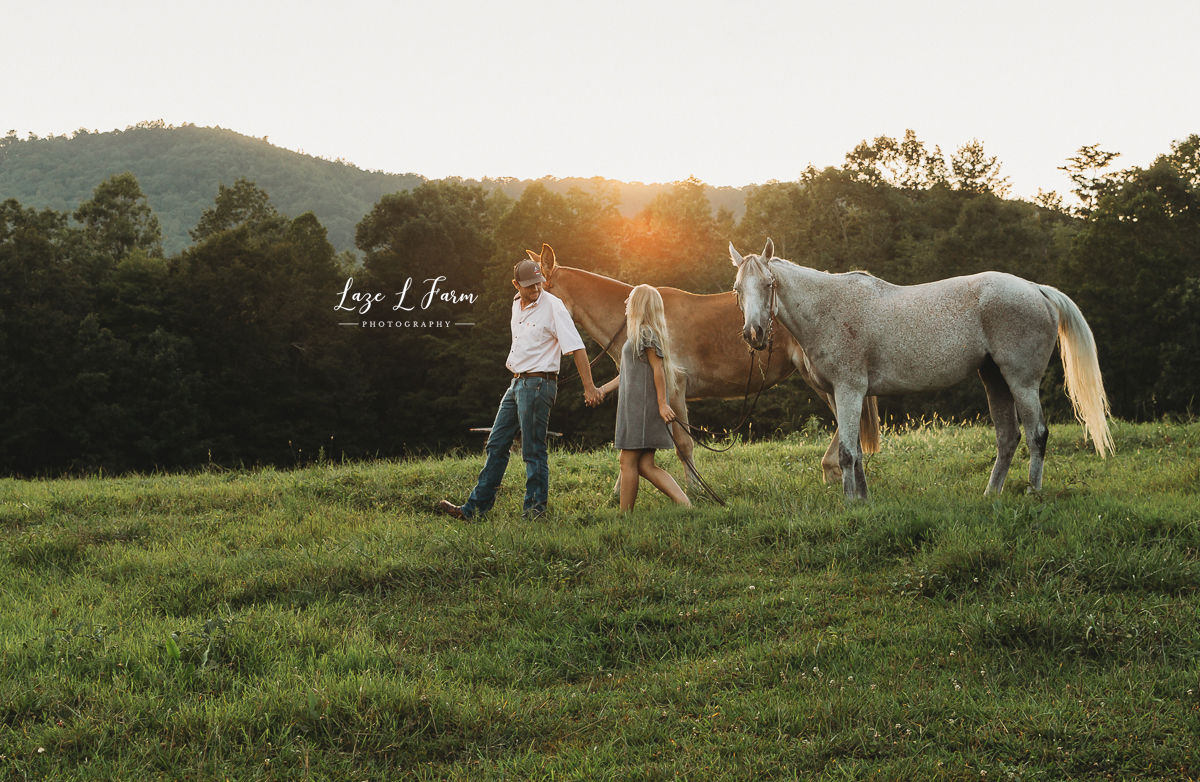 Laze L Farm Photography | Equine Session | Couple Session | Taylorsville NC | couple walking through field with horses