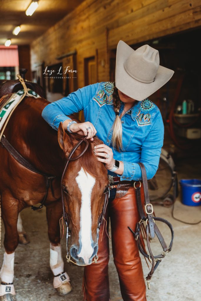 Laze L Farm Photography | Western Lifestyle | Equine Session | Taylorsville NC | cowgirl bridling her horse