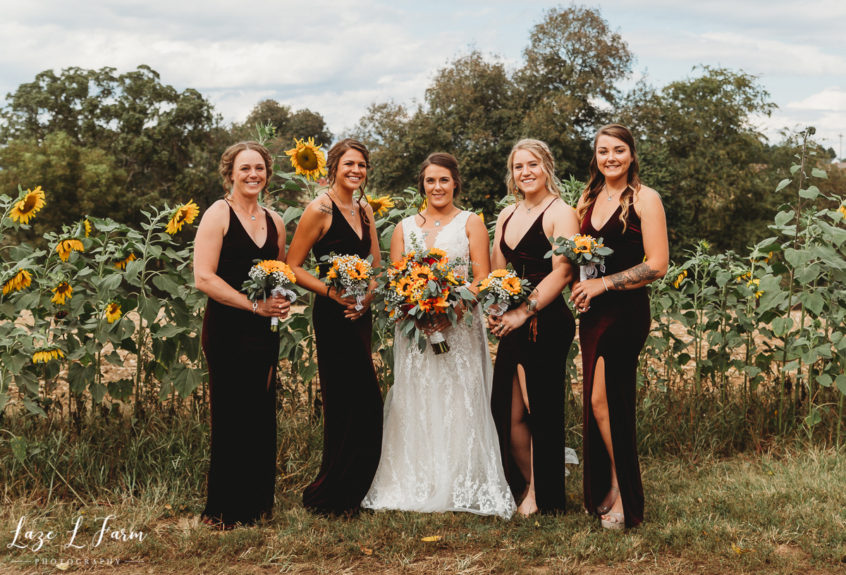 Laze L Farm Photography | Western Wedding | Johnny Wilson Farm | Bridesmaids in Sunflower Field