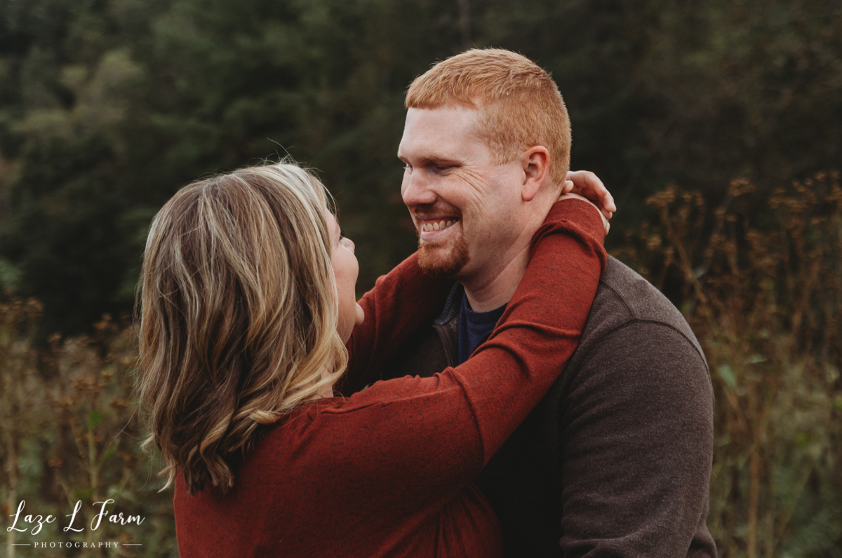 Laze L Farm Photography | Farm Pregnancy Announcement | Taylorsville NC | Husband Smiling At Wife