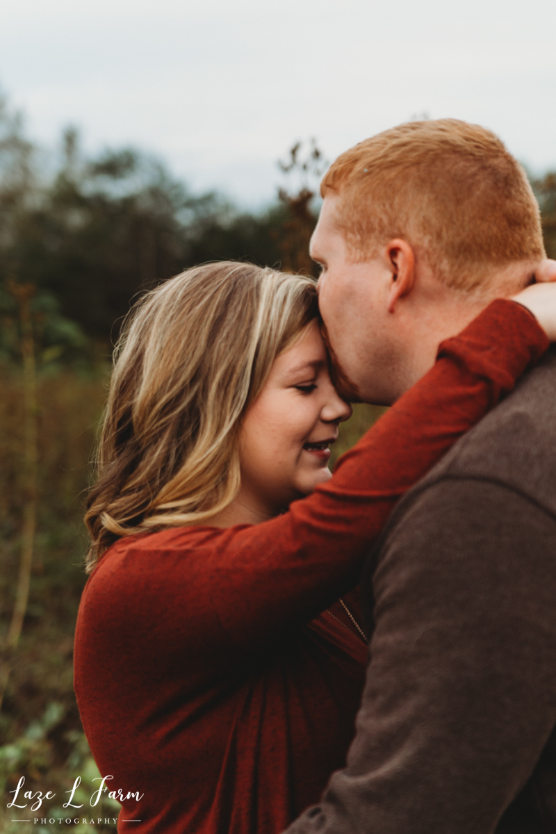 Laze L Farm Photography | Farm Pregnancy Announcement | Taylorsville NC | Husband Wife Forehead Kisses