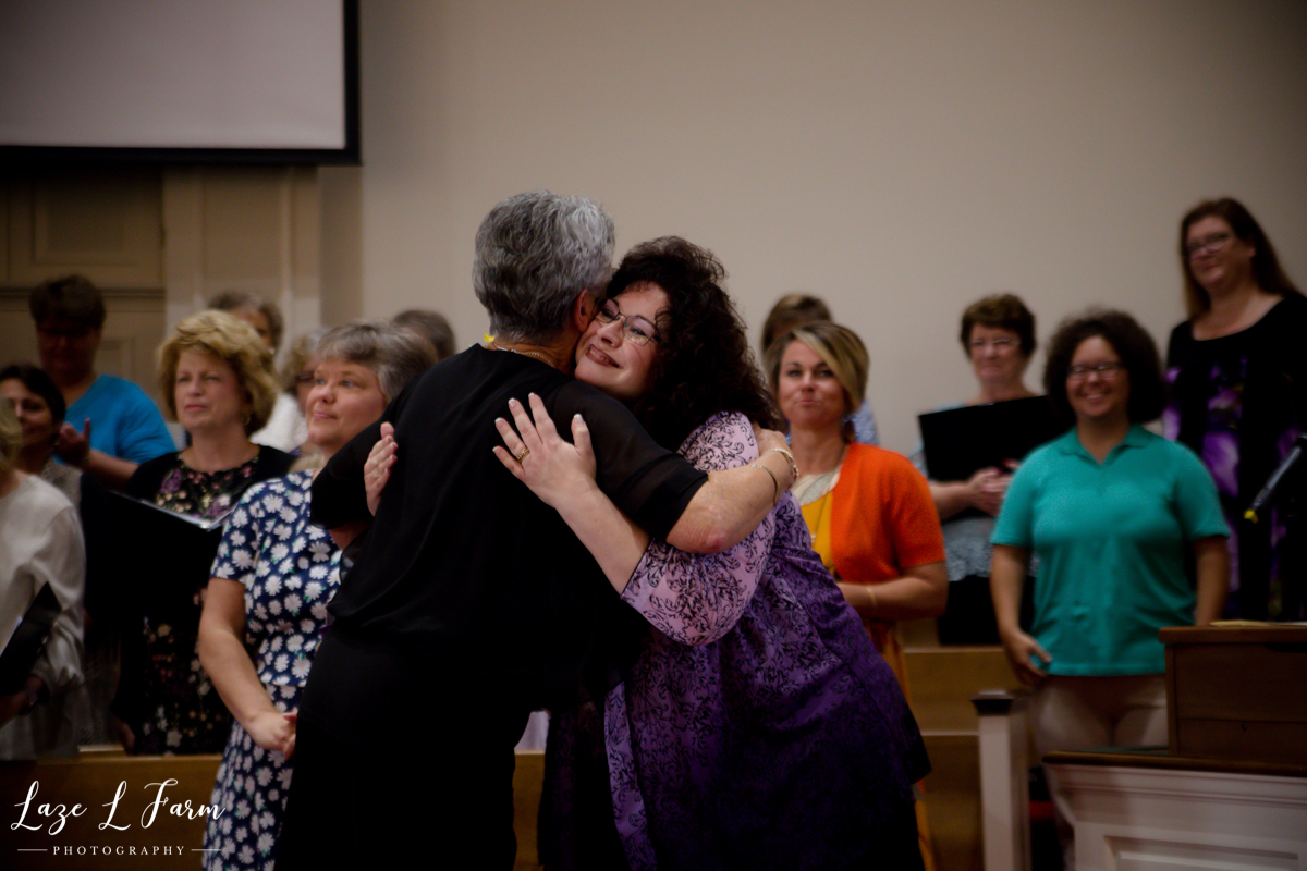 Laze L Farm Photography | 50 years as Choir Director | Antioch Baptist Church- Taylorsville NC | Ladies Hugging