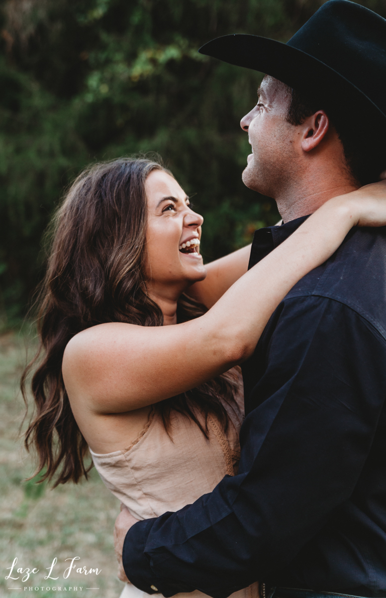 Laze L Farm Photography | Western Engagement Session | Cleveland NC | Cowgirl Laughing