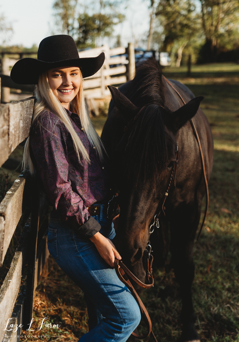 Laze L Farm Photography | Western Equine Photography | Payton Bush | Taylorsville NC | cowgirl leaning against a fence
