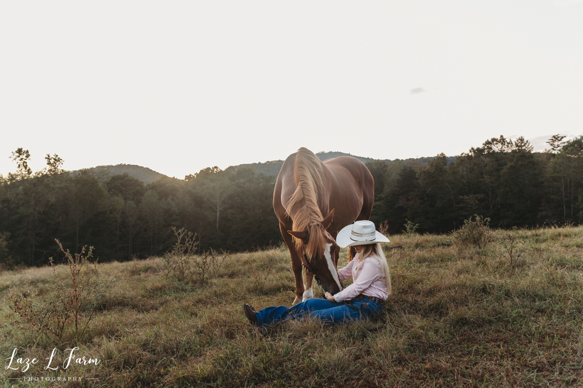 Laze L Farm Photography | Western Equine Photography | Payton Bush | Taylorsville NC | Cowgirl Sitting In Field With Her Horse