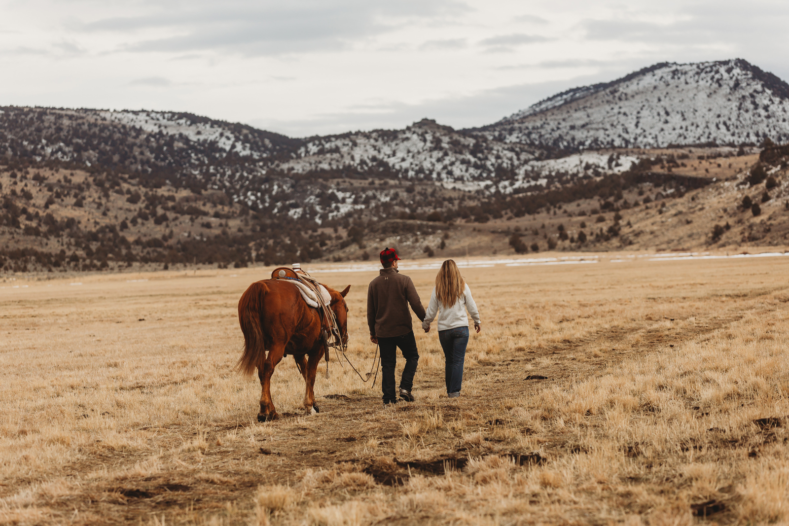 Laze L Farm Photography | CDPhotog Photography Workshop | Burns OR | cowboy couple walking in a field