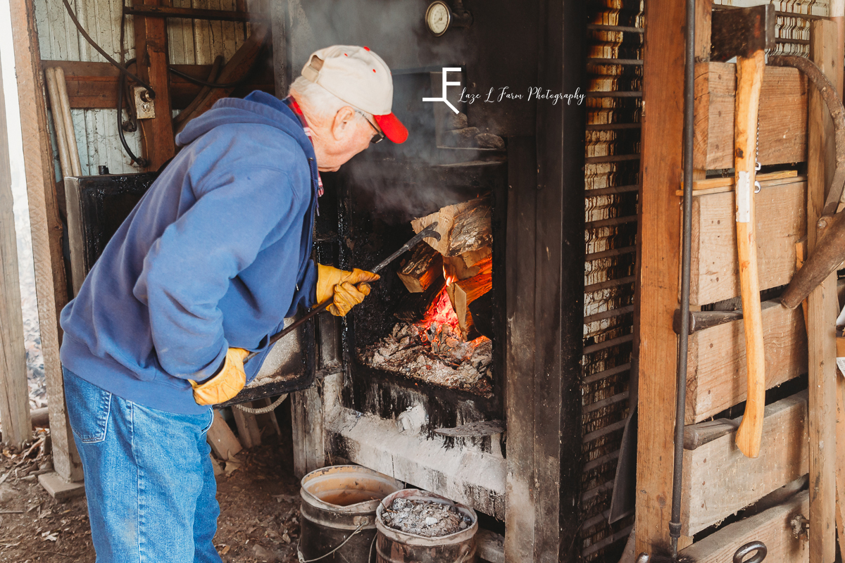 Laze L Farm Photography | Farm Session | Reid Tomlin | Statesville NC | grandfather loading firewood into the wood stove