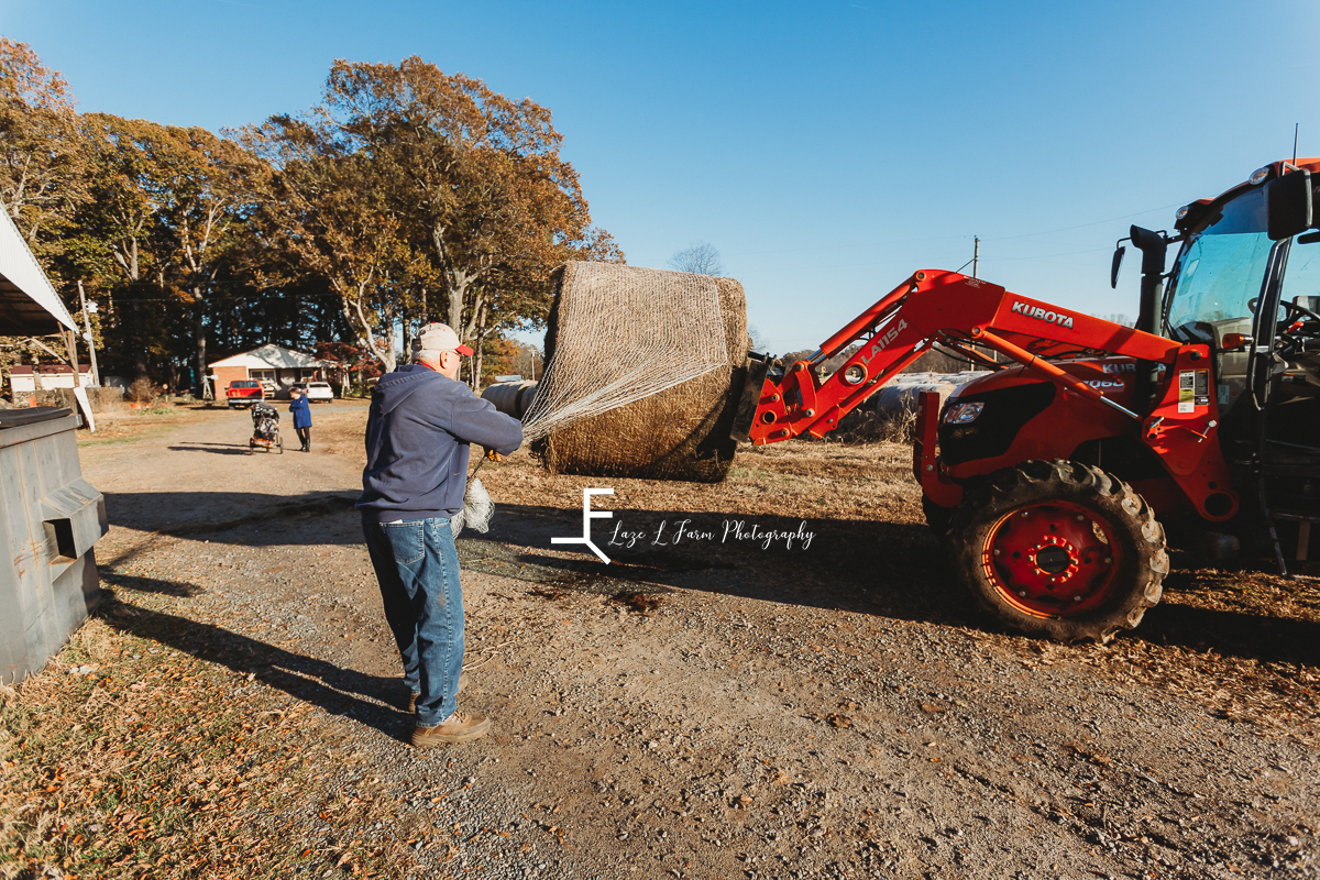 Laze L Farm Photography | Farm Session | Reid Tomlin | Statesville NC | farmer putting out hay