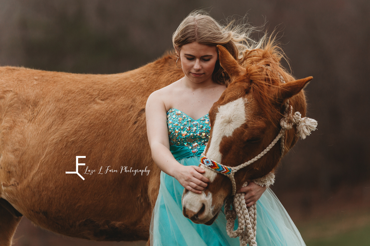 Laze L Farm Photography | Senior Session | Taylorsville NC | a girl in a teal dress petting her horse