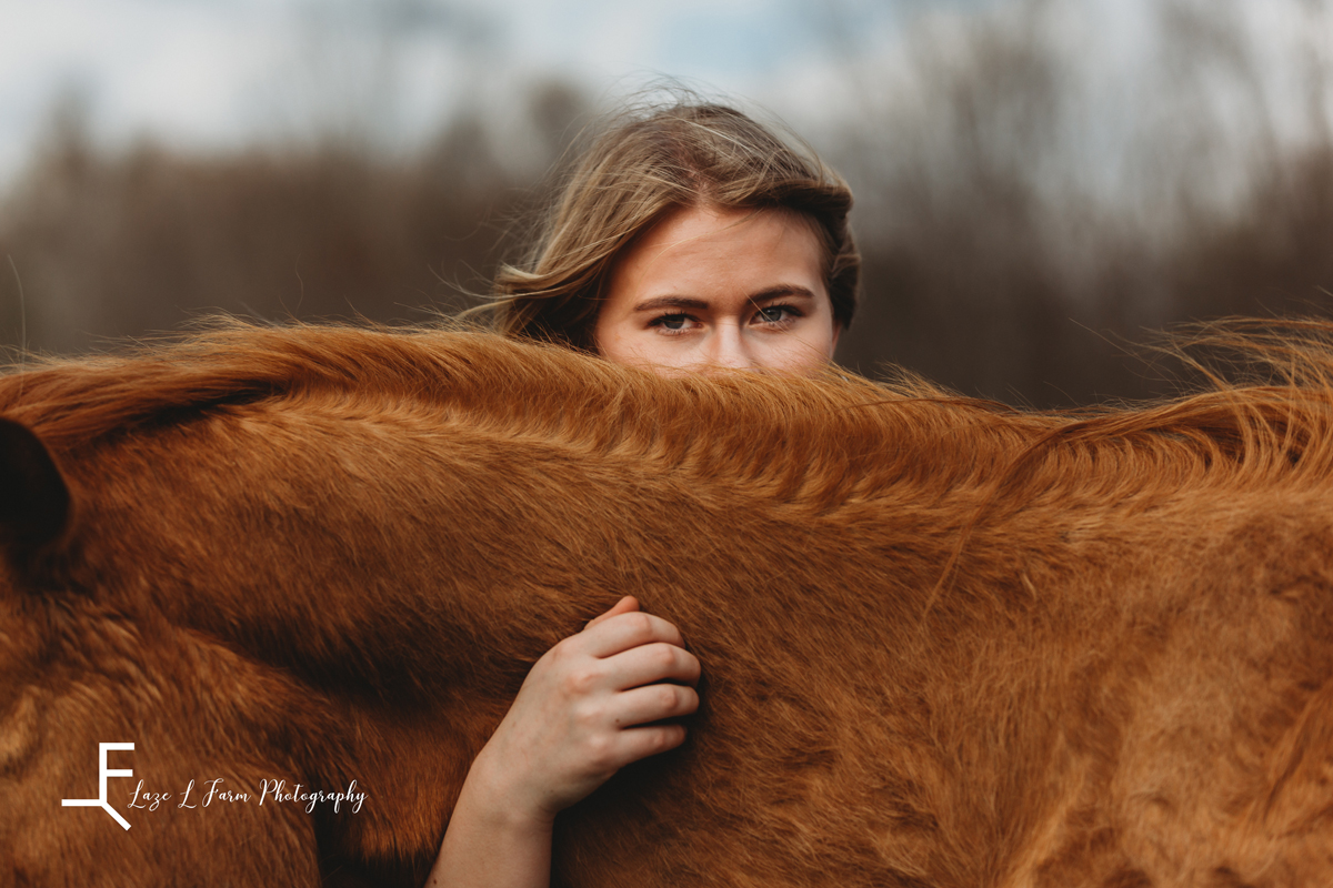 Laze L Farm Photography | Senior Session | Taylorsville NC | a girl looking over her horses neck