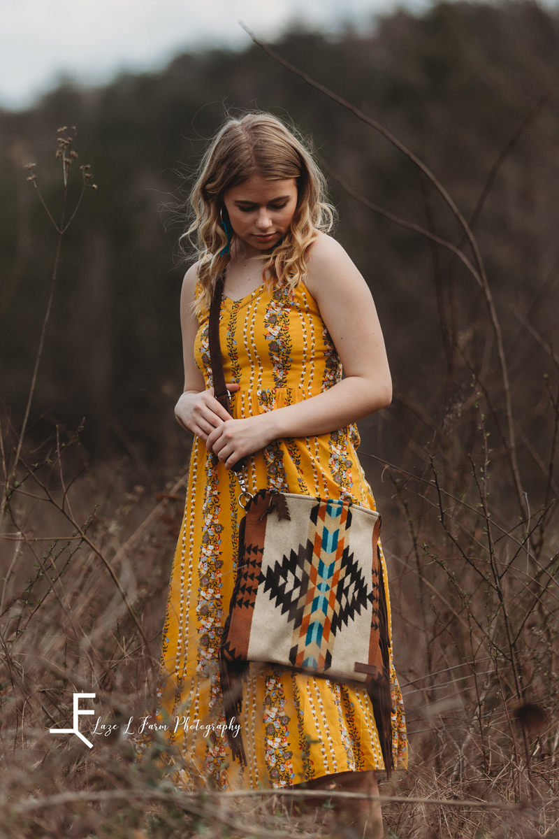 Laze L Farm Photography | Senior Session | Taylorsville NC | a girl walking in a field 