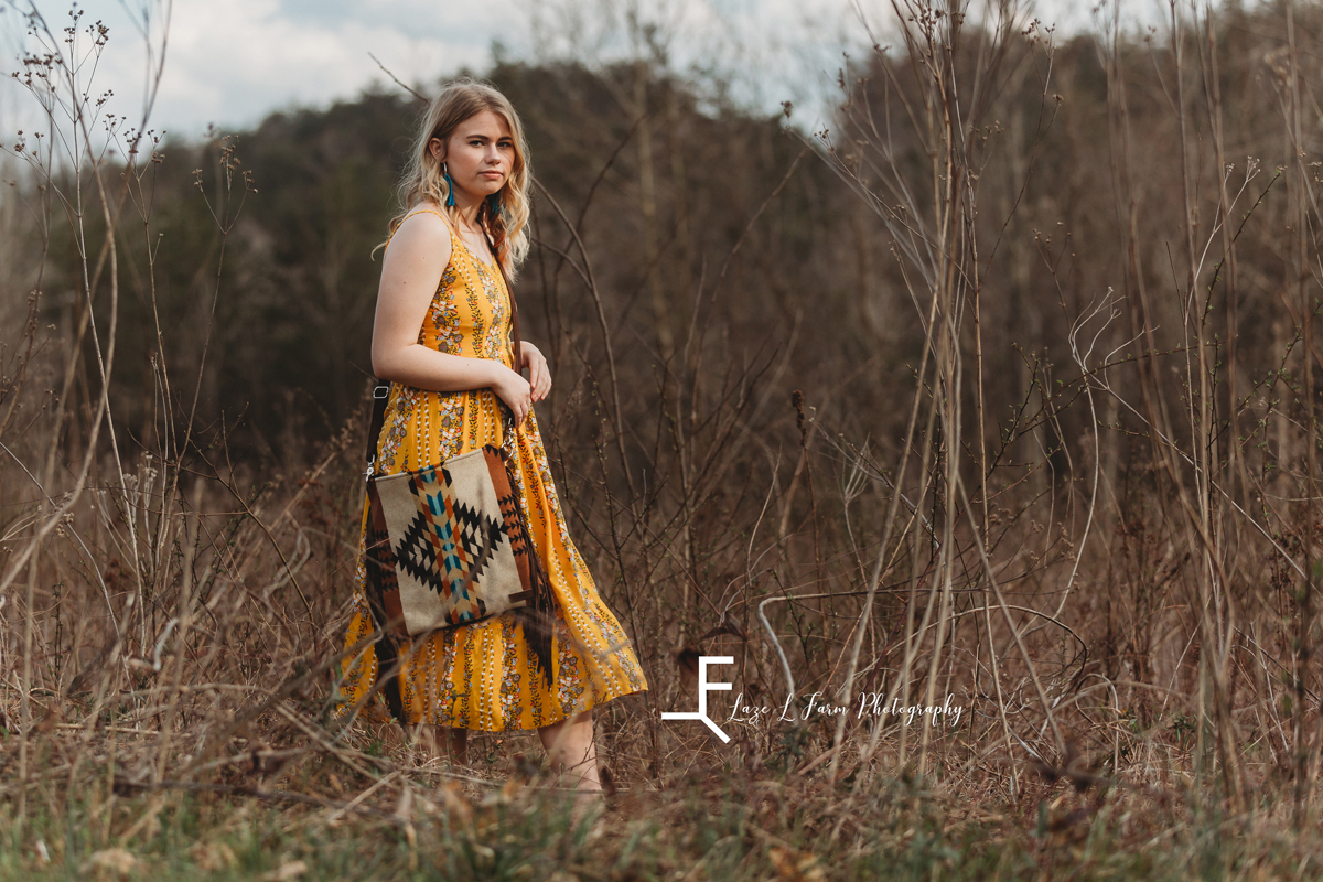Laze L Farm Photography | Senior Session | Taylorsville NC | a girl walking in a field
