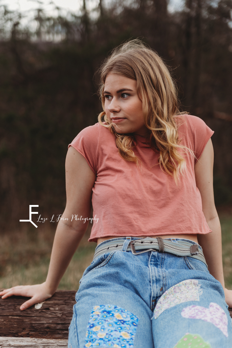 Laze L Farm Photography | Senior Session | Taylorsville NC | a girl sitting on a log
