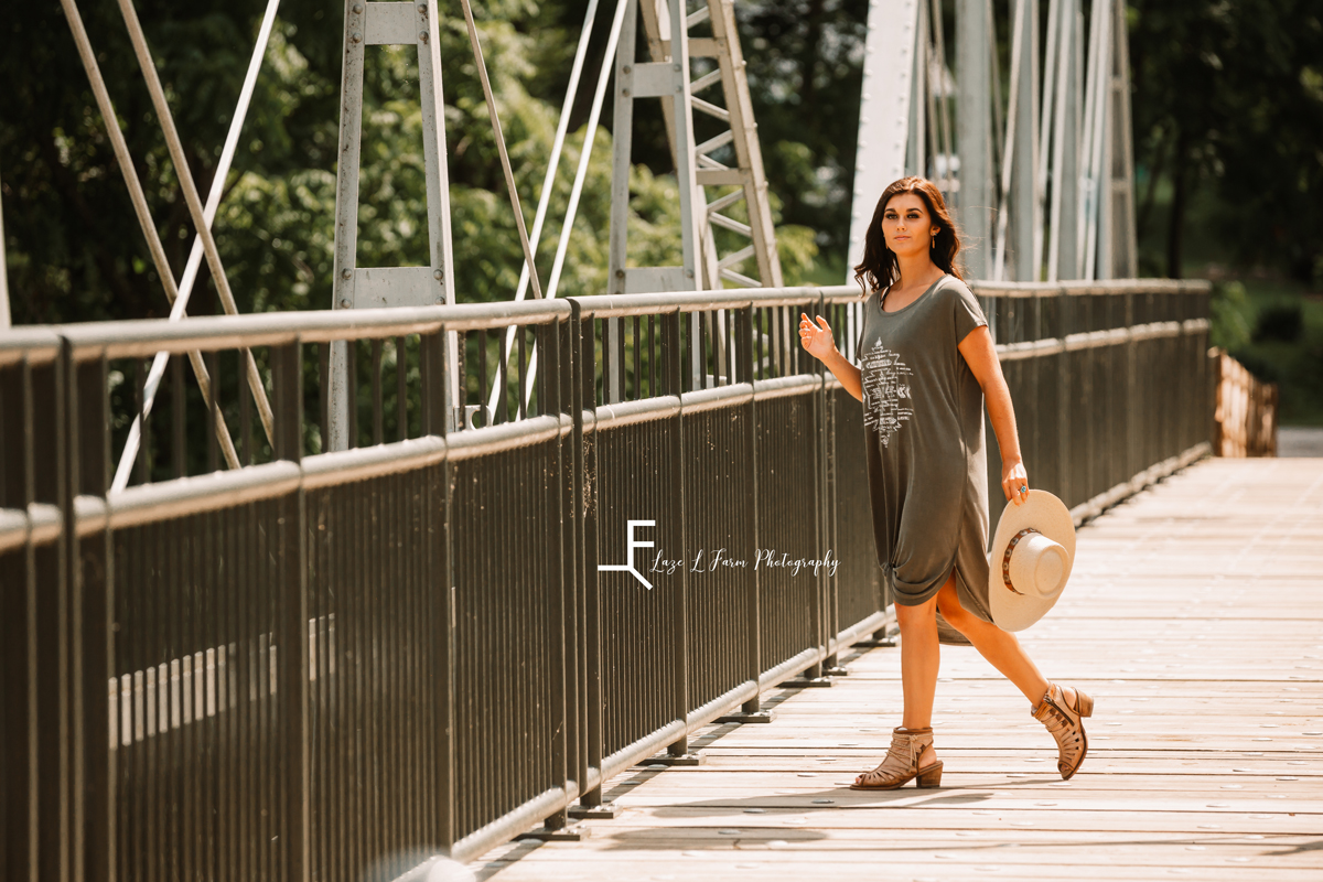 Laze L Farm Photography | Western Fashion | Rural Retreat, VA | Jenna posing with hat prop on the bridge