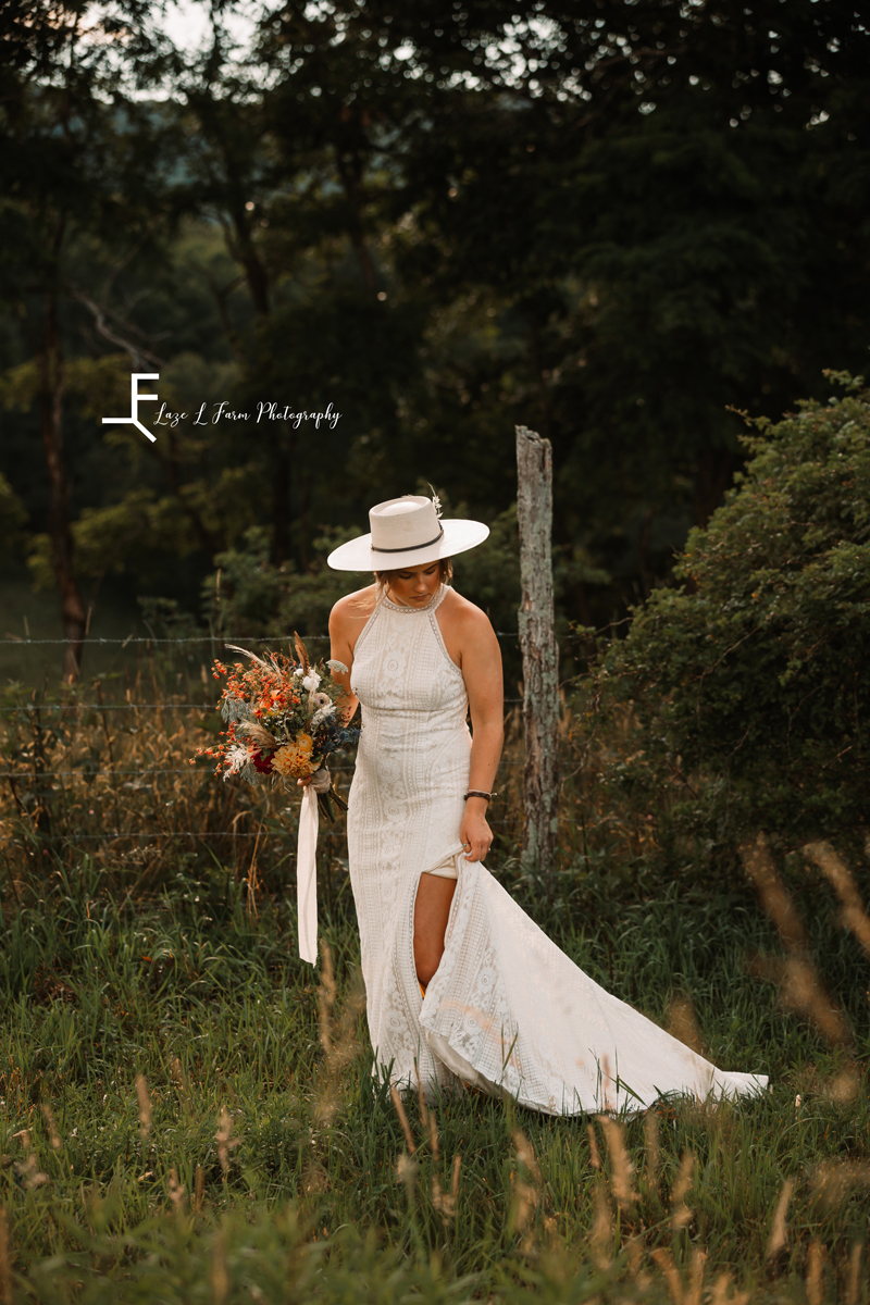 Laze L Farm Photography | The White Crow | Wedding Venue | Banner Elk NC | Walking with bouquet