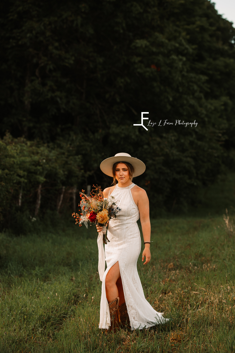 Laze L Farm Photography | The White Crow | Wedding Venue | Banner Elk NC | Posing at the camera with bouquet