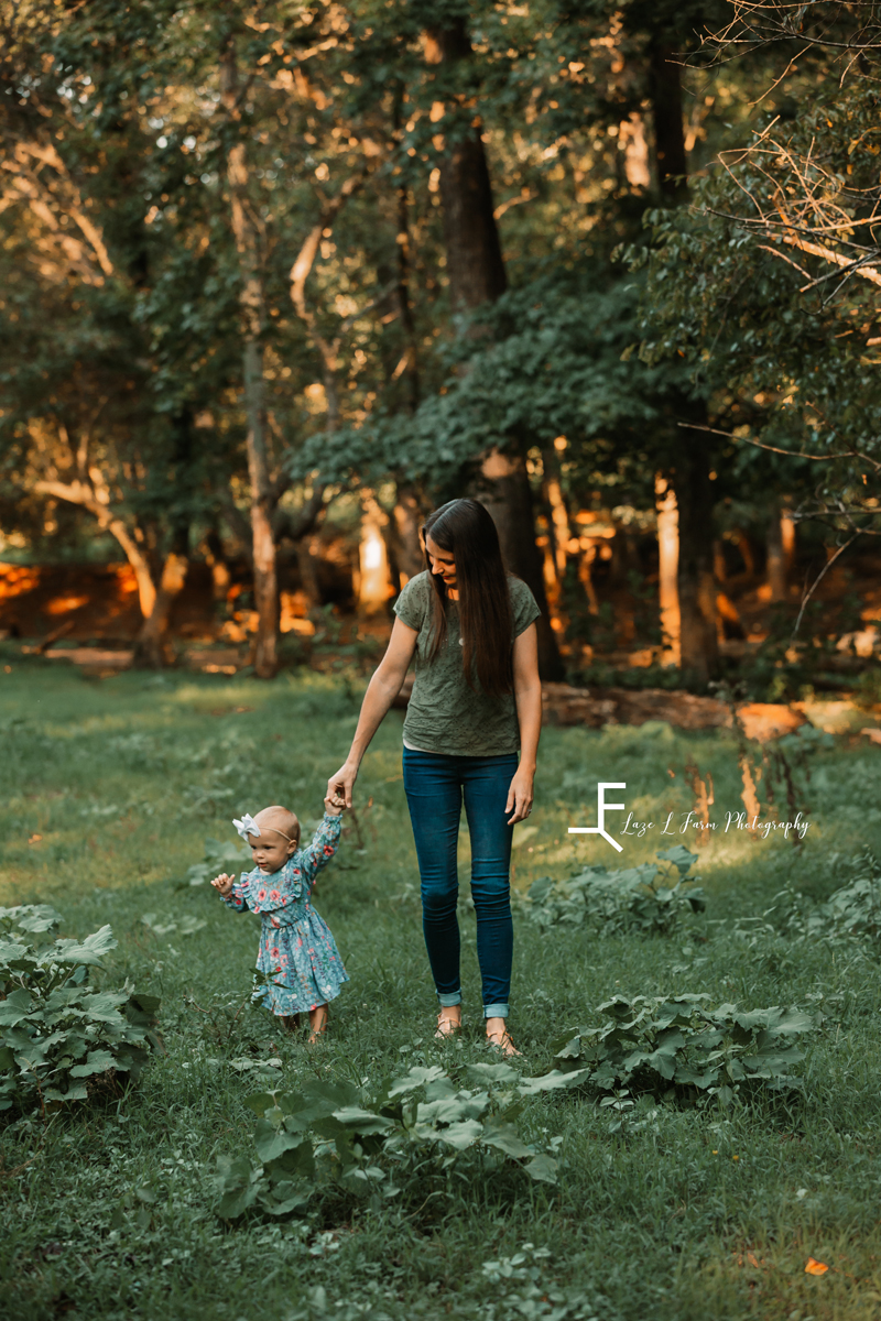 Laze L Farm Photography | Farm Session | Taylorsville NC | mother and daughter walking in a field