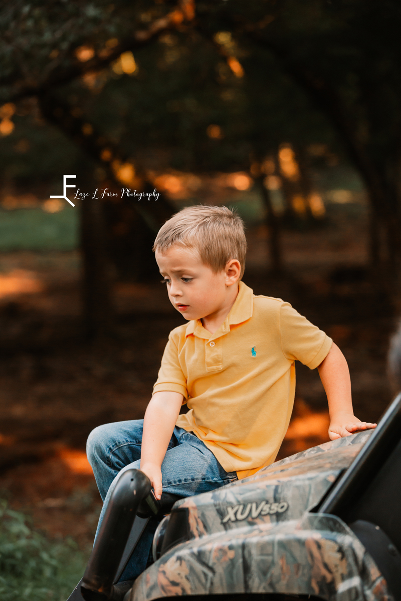 Laze L Farm Photography | Farm Session | Taylorsville NC | little boy sitting on the side by side