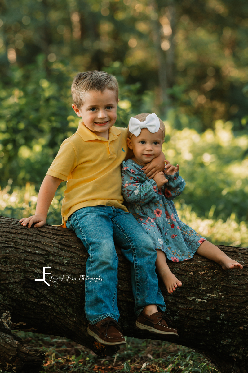 Laze L Farm Photography | Farm Session | Taylorsville NC | brother and sister sitting on a tree