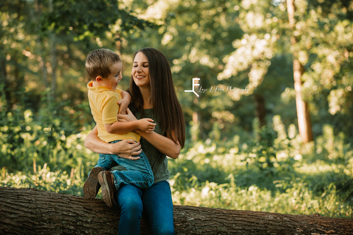 Laze L Farm Photography | Farm Session | Taylorsville NC | mother and daughter sitting on a tree