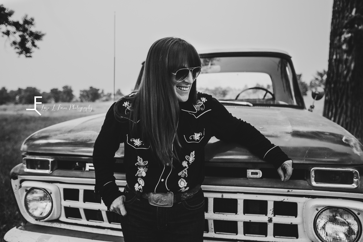 Laze L Farm Photography | Billings Montana | B&W Mary standing in front of truck