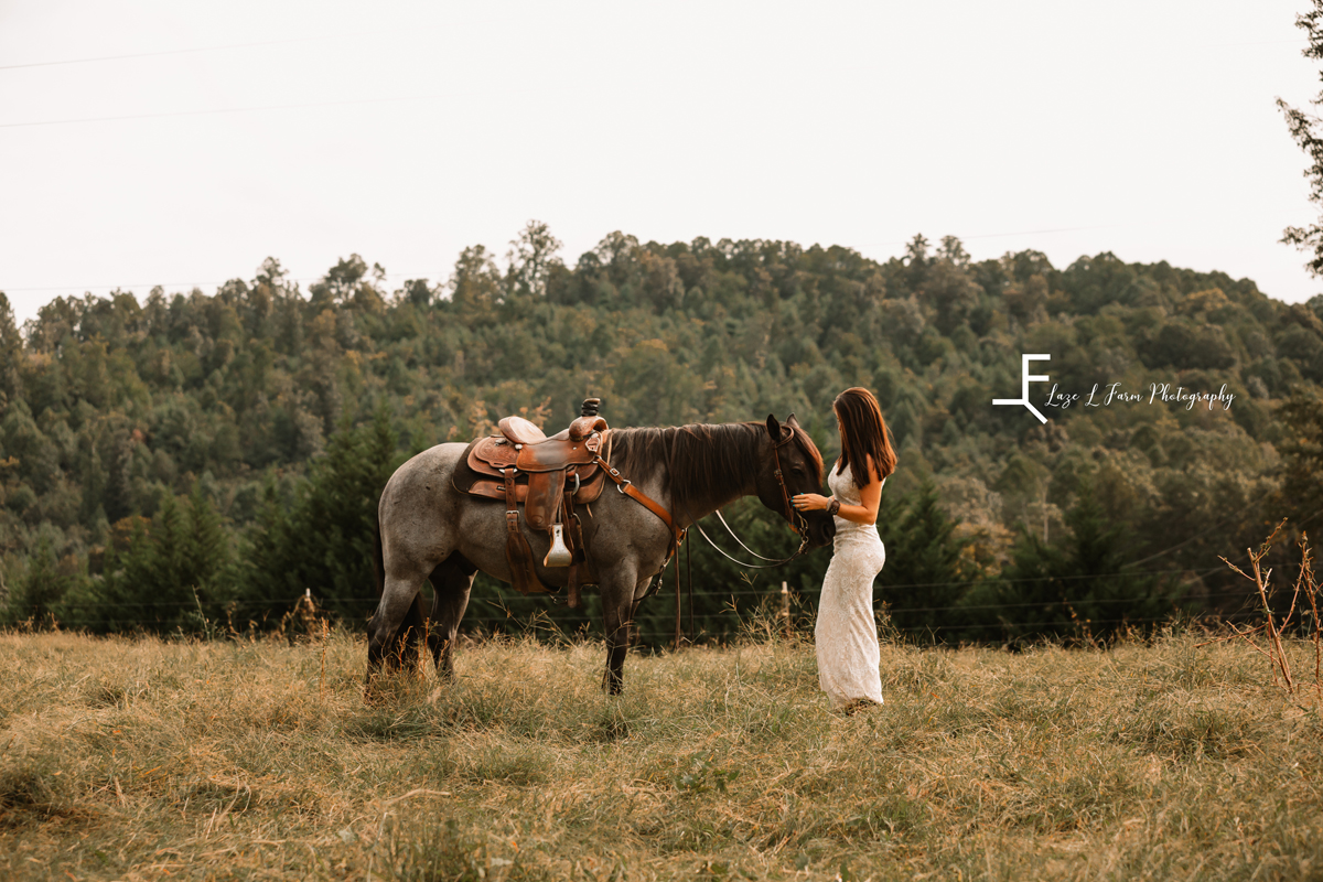  Laze L Farm Photography | Equine Photography | Taylorsville NC | Danielle standing with horse, wide shot with landscape