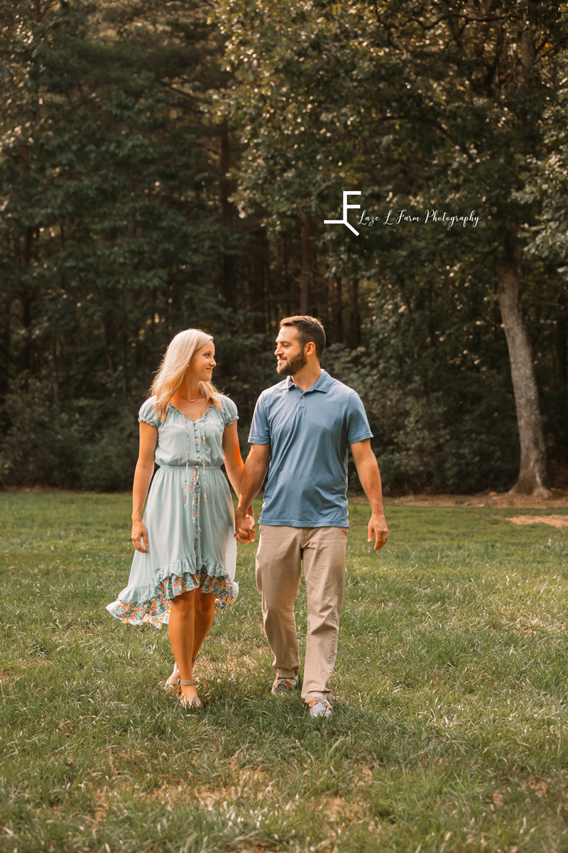 Laze L Farm Photography | Farm Session | Bethlehem NC | Parents walking and smiling at each other
