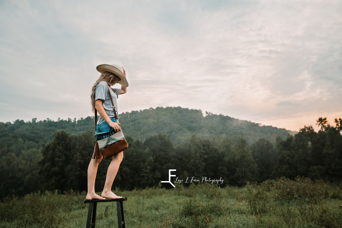 Laze L Farm Photography | Western Lifestyle | Taylorsville NC | Standing on a stool with bag and hat