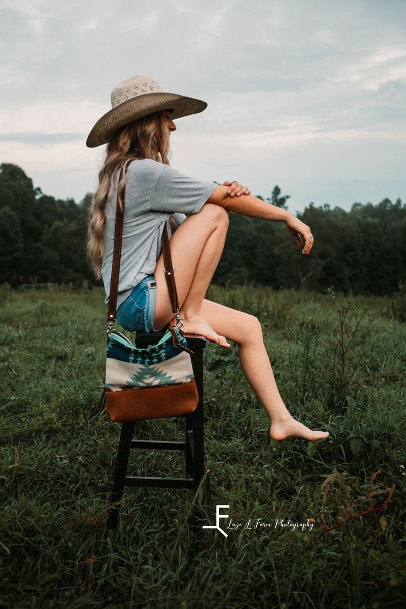 Laze L Farm Photography | Western Lifestyle | Taylorsville NC | Sitting on the stool modeling the bag