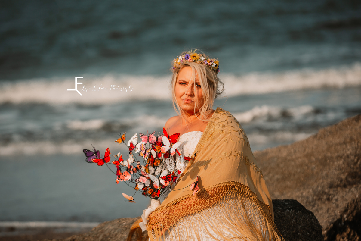 Laze L Farm Photography | Beach Bridals | Tybee Island GA | Posing on the rocks with bouquet