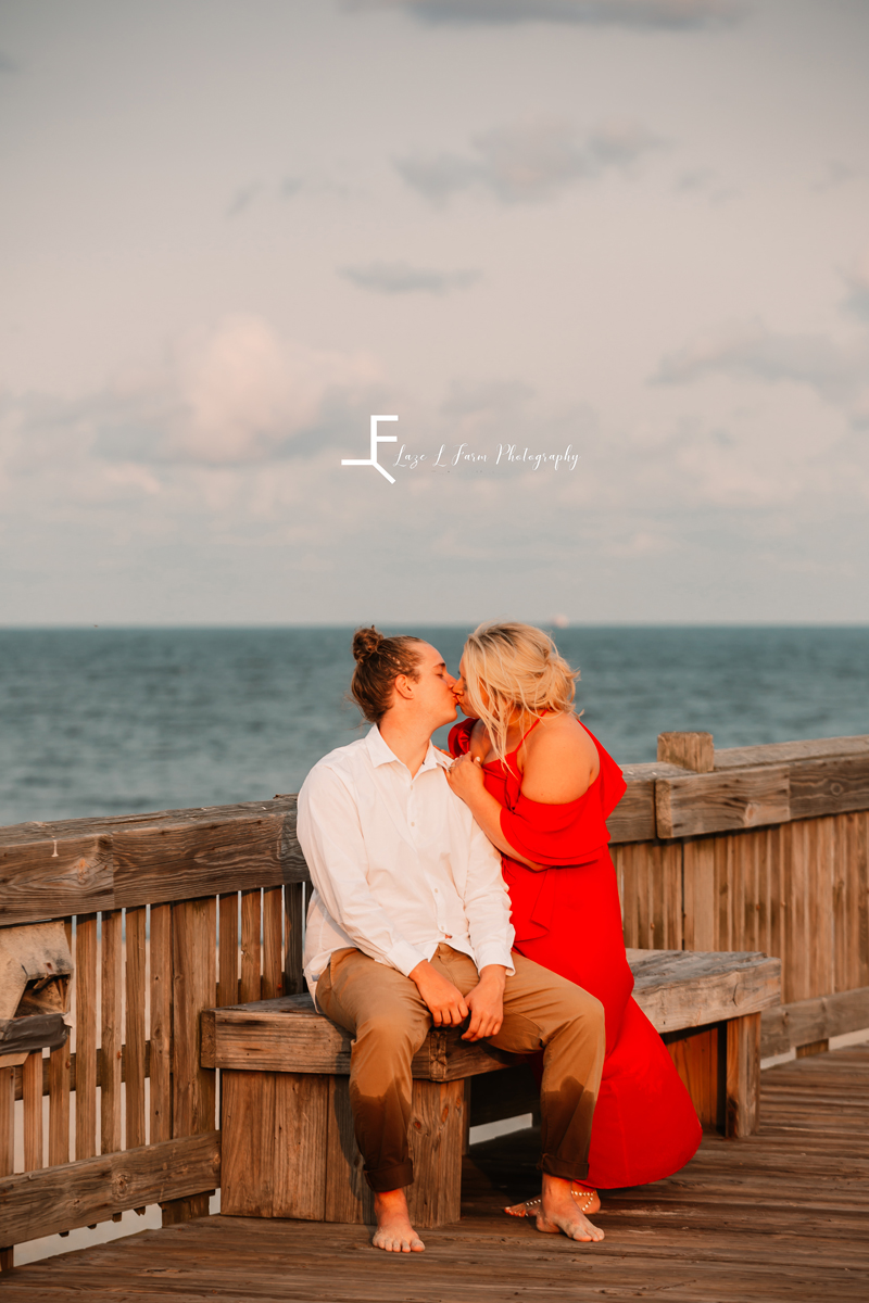Laze L Farm Photography | Beach Session | Tybee Island GA | kissing on a bench on the pier