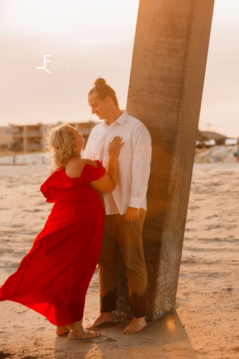 Laze L Farm Photography | Beach Session | Tybee Island GA | couples pose under the pier