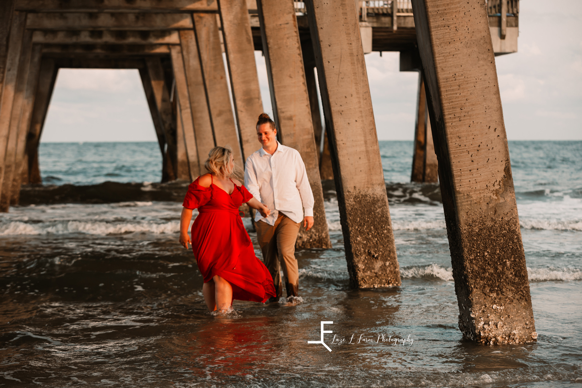 Laze L Farm Photography | Beach Session | Tybee Island GA | walking in the water under the pier