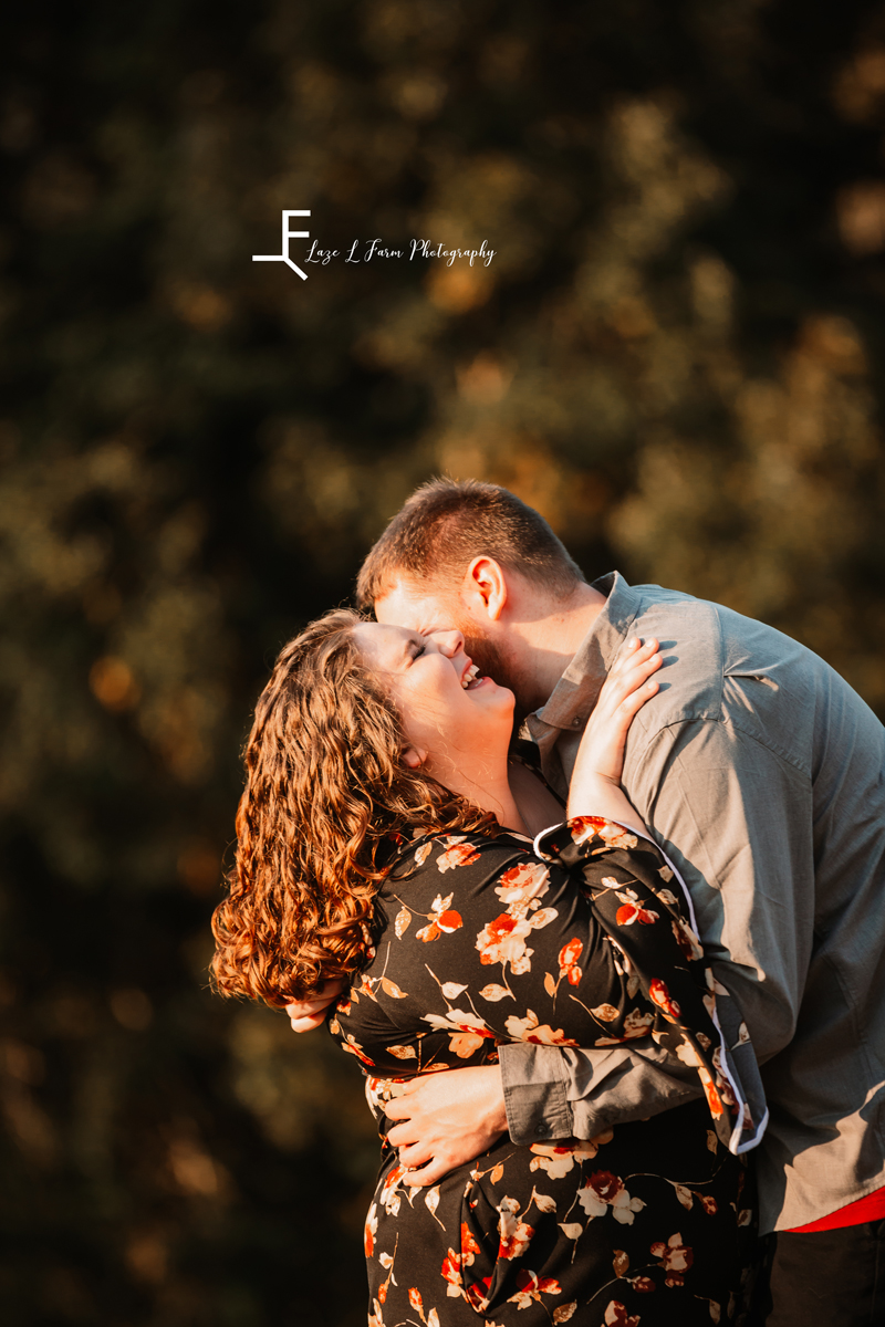 Laze L Farm Photography | Engagement Photography | Taylorsville NC | holding each other and laughing