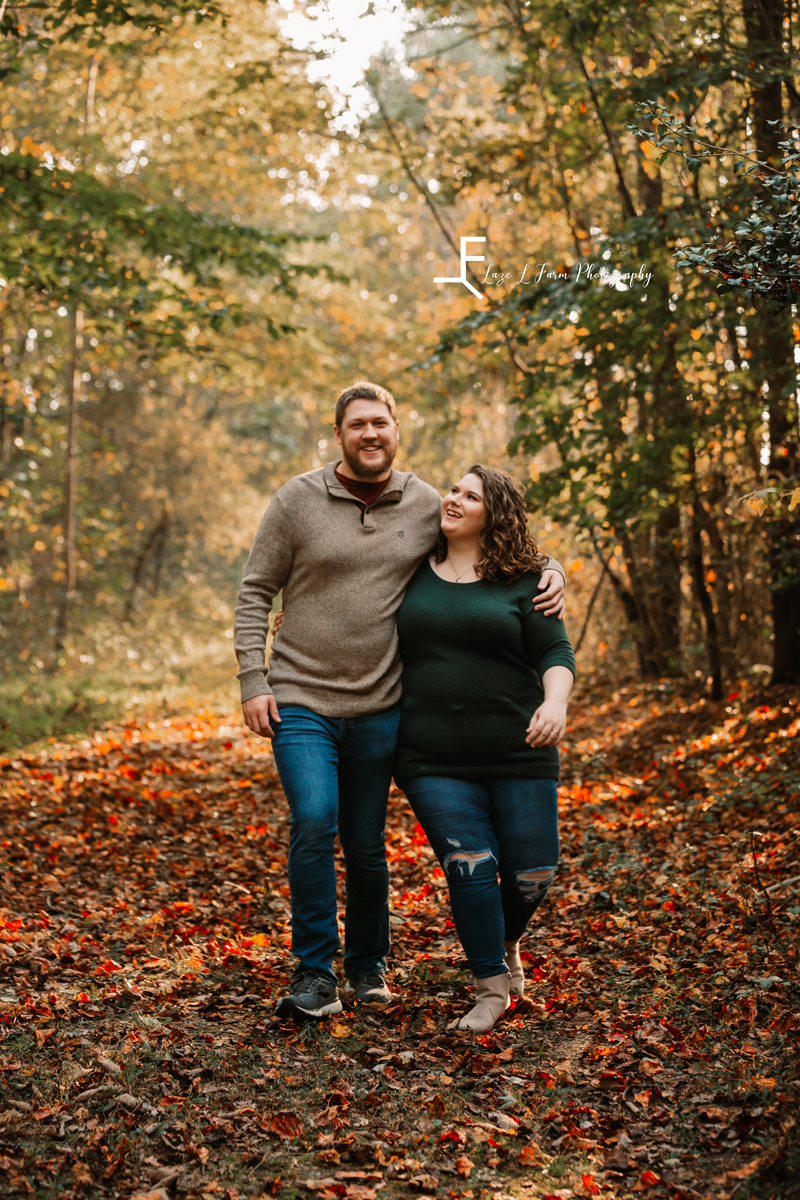Laze L Farm Photography | Engagement Photography | Taylorsville NC | walking holding each other, candid
